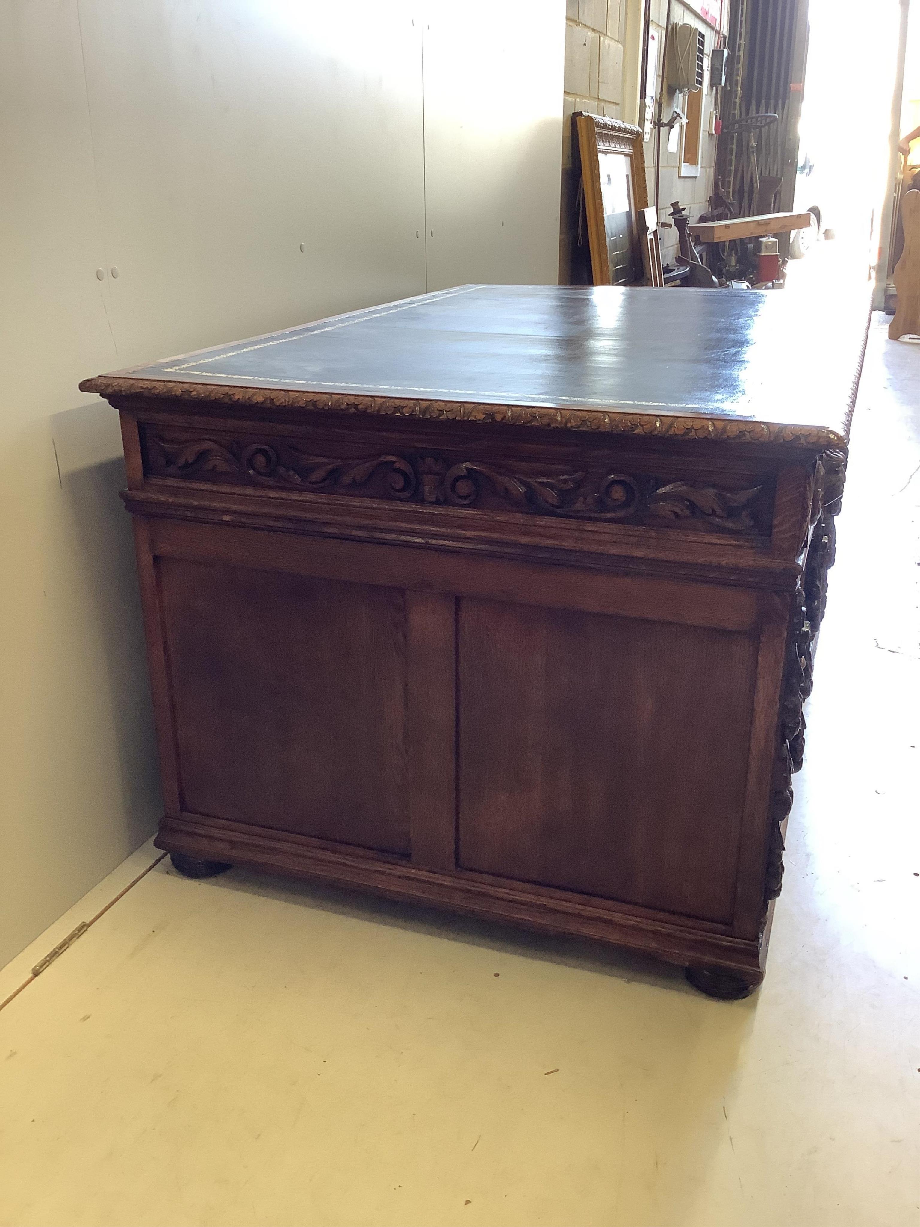 A Victorian carved oak pedestal desk, width 148cm, depth 92cm, height 78cm. Condition - good